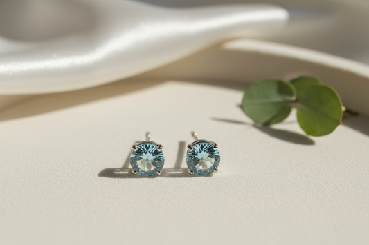 Elegant stud earrings featuring sparkling aquamarine earring stones, perfect for ethical jewelry design inspiration